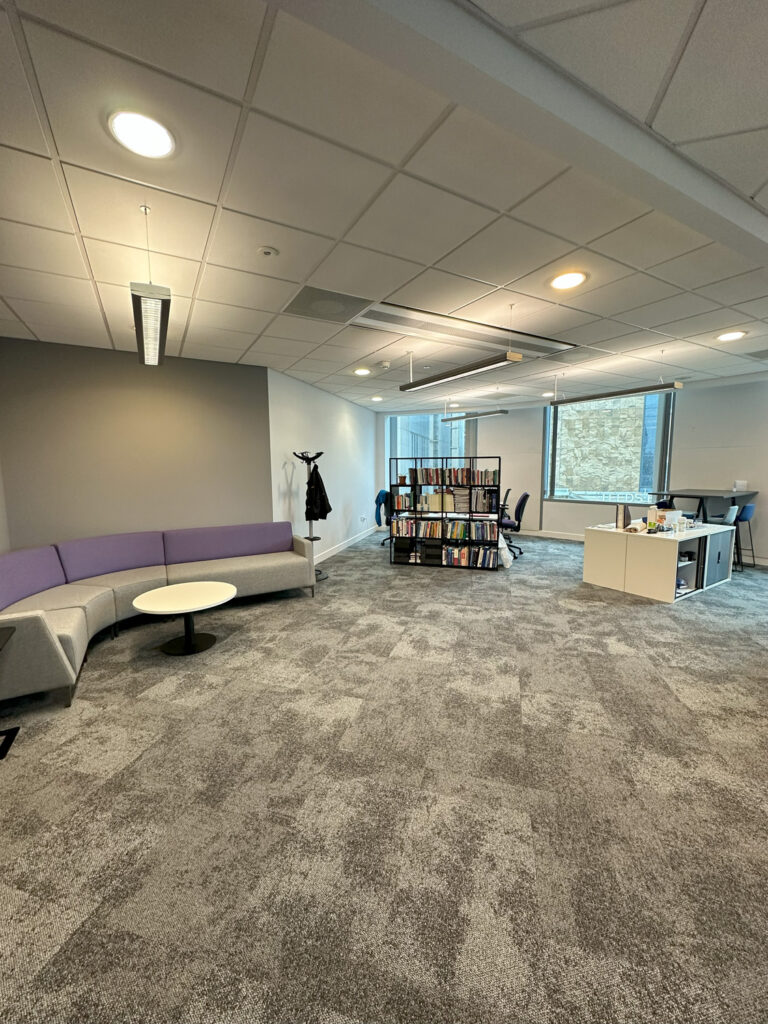 University office with desks and breakout sofa